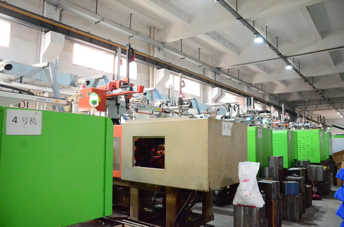 Ten Haitian injection moulding machines running in a line at the ALX e-bike battery case factory